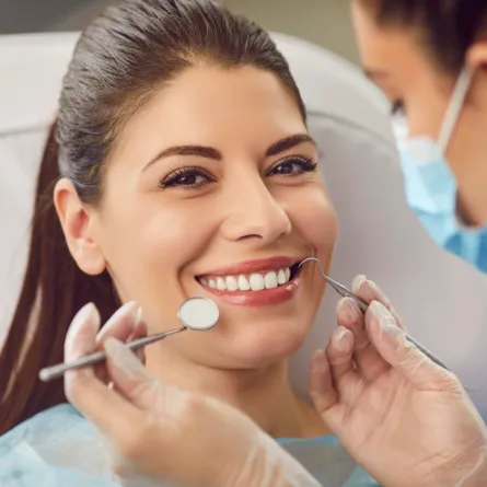 Close-up of a patient receiving restorative dentistry treatment, focusing on dental care and tooth restoration